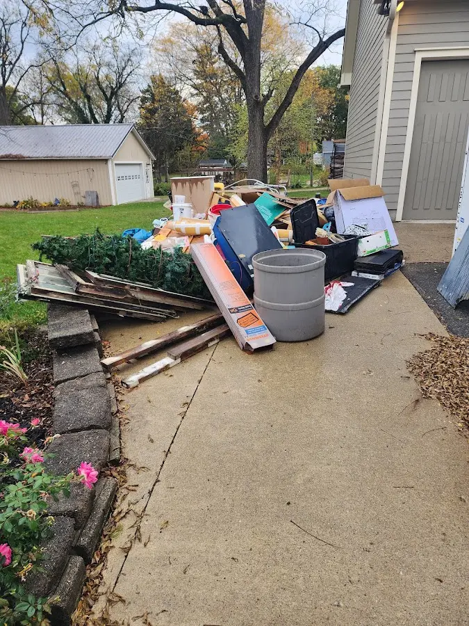 Dumpster being loaded with debris for Commercial Dumpster Rental in Simonton Lake